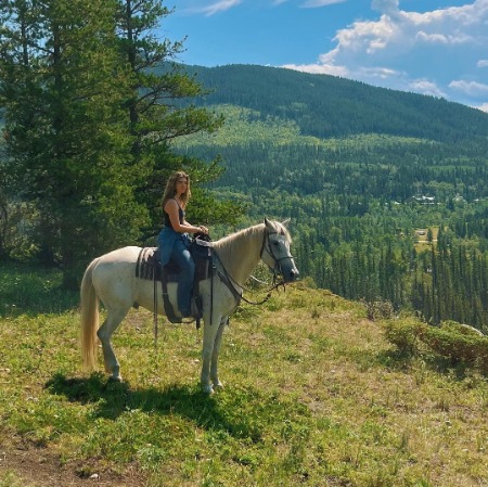 Alisha Newton horse riding at Rocky Mountains, Canada. 